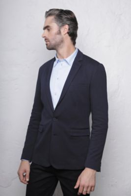 BLAZER MAILLE PIQUÉE HOMME<br/><p>Ce blazer allie le chic formel de la veste de costume au confort de la maille piquée.<br />Polyvalente, elle peut se porter avec un pantalon de ville pour un look classique comme avec un denim pour une silhouette plus décontractée.</p> NEOBLU MARCEL MEN